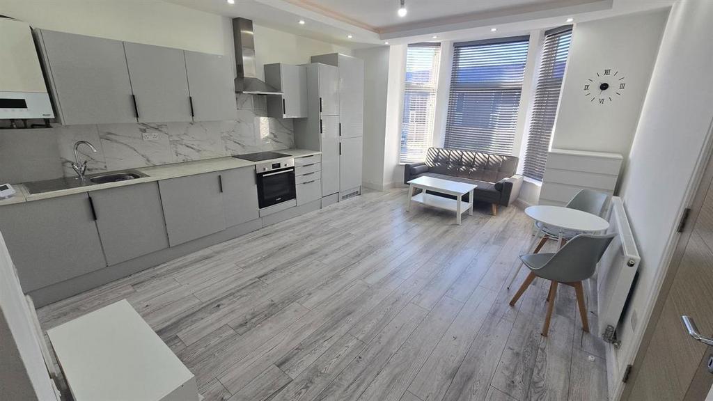 Bright and modern kitchen with ample natural li...