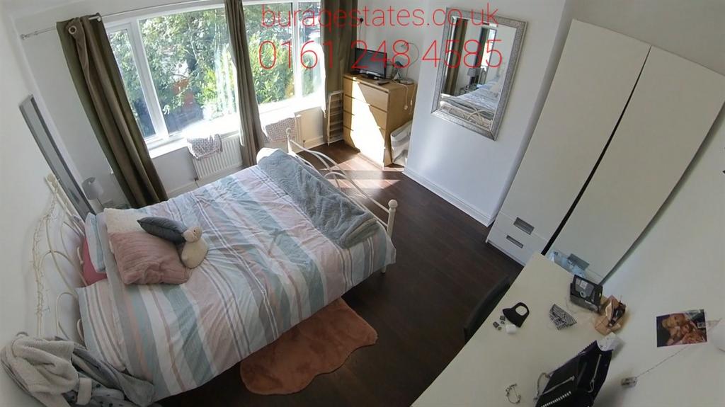 A cozy single bedroom featuring a single bed wi...