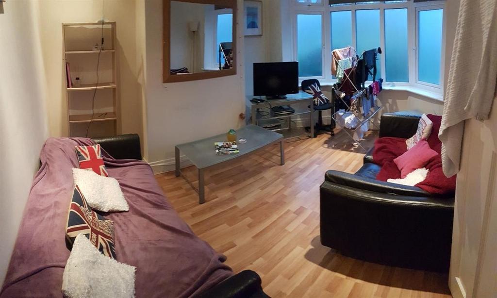 Spacious and welcoming living room featuring co...