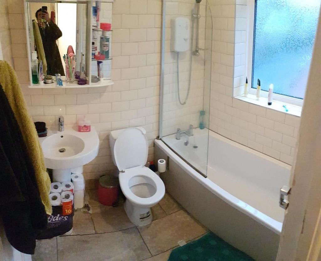A clean and well-maintained bathroom featuring ...