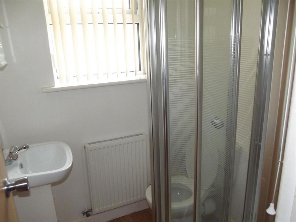 A clean and well-maintained bathroom featuring ...