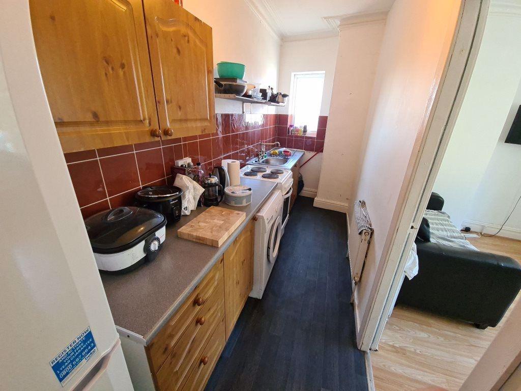 A compact but well-maintained kitchen with esse...