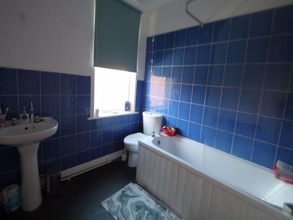 A bright and well-maintained bathroom featuring...