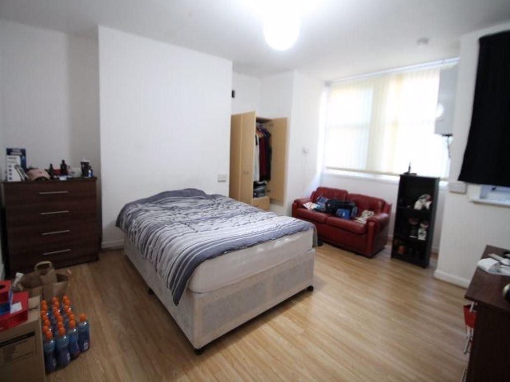 Bright and spacious master bedroom featuring a ...
