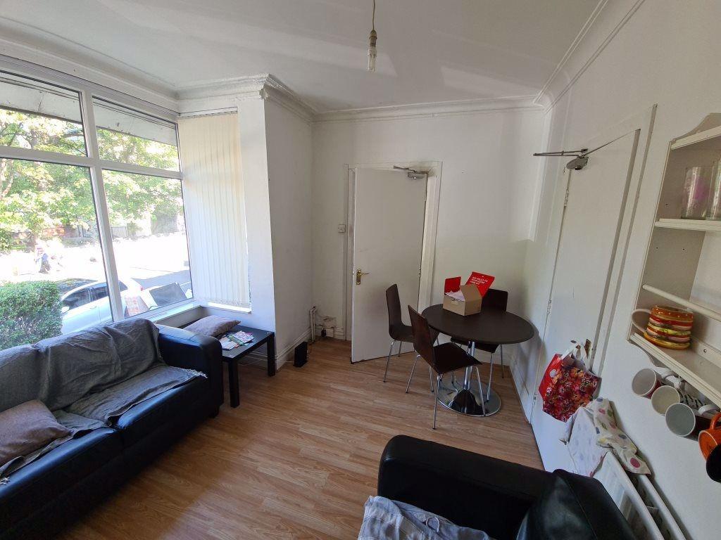 A bright and inviting living room featuring a c...