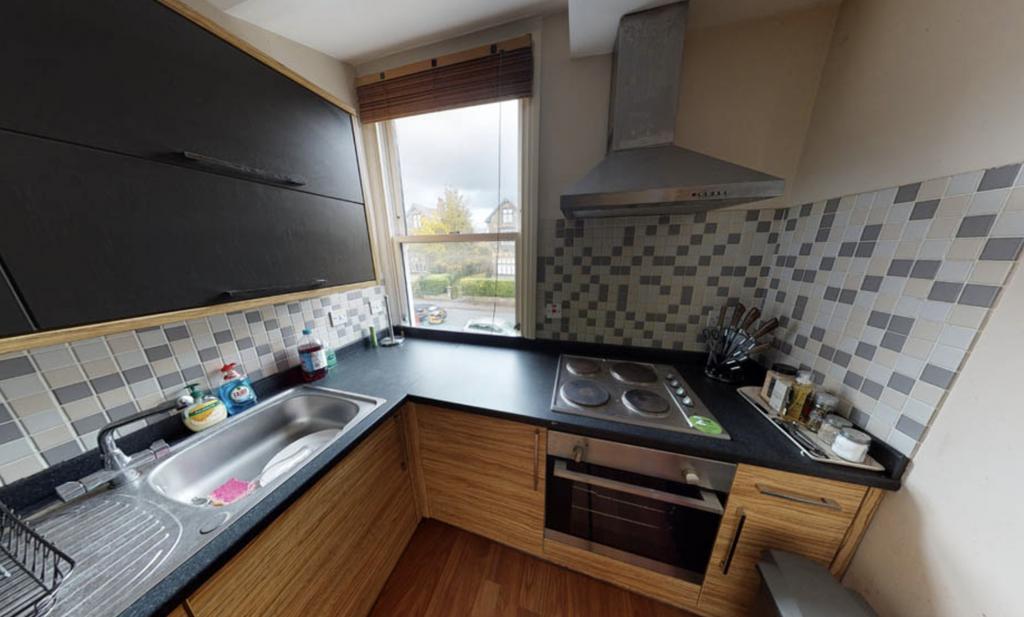 A bright and modern kitchen with ample counter ...