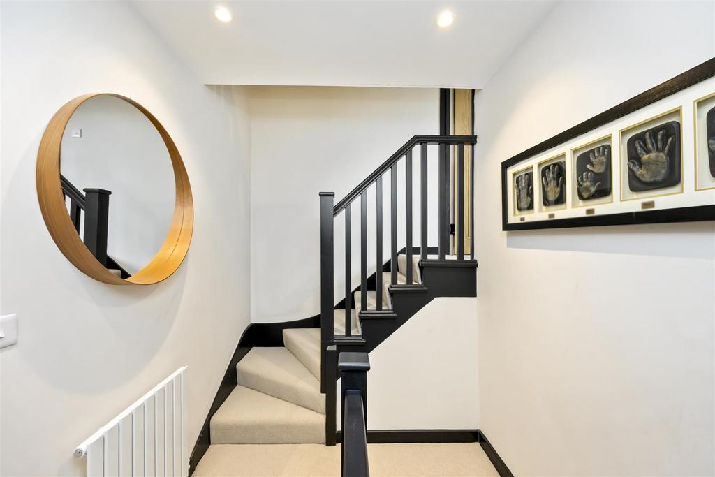 Stairs rising to First Floor