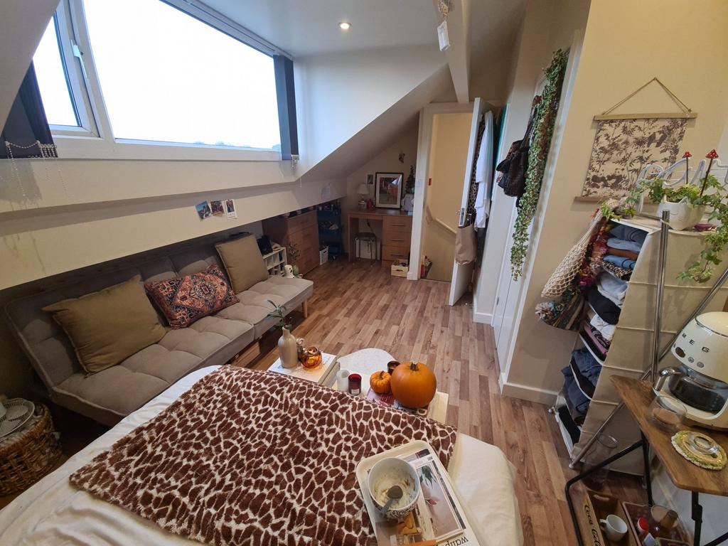 A cozy and welcoming living room filled with na...