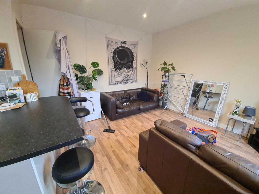 A spacious and well-lit contemporary living roo...