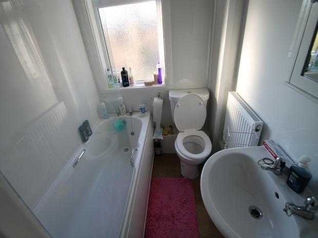A clean and well-maintained bathroom with a lar...