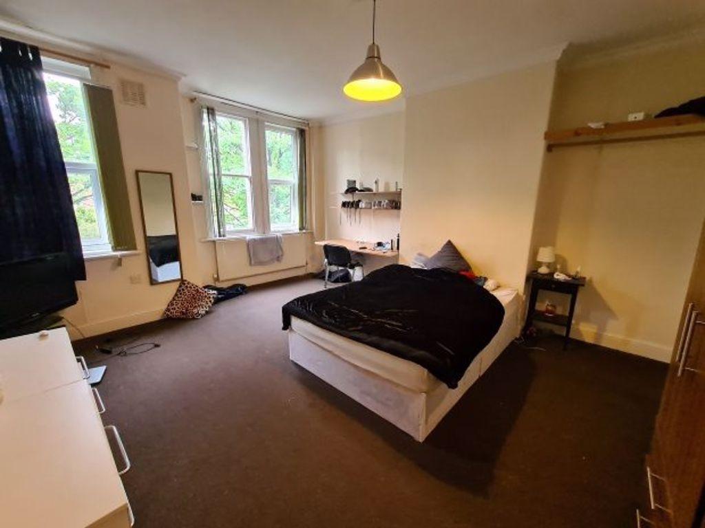 A welcoming bedroom featuring a comfortable dou...