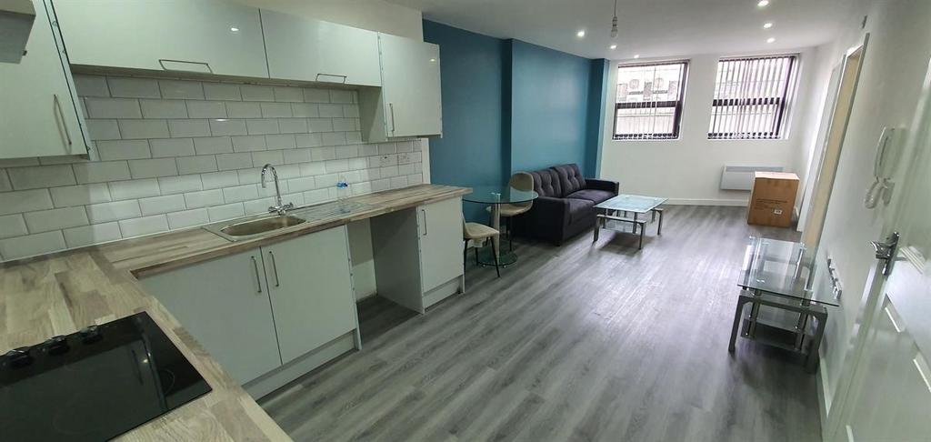 Bright and spacious living area with ample natu...
