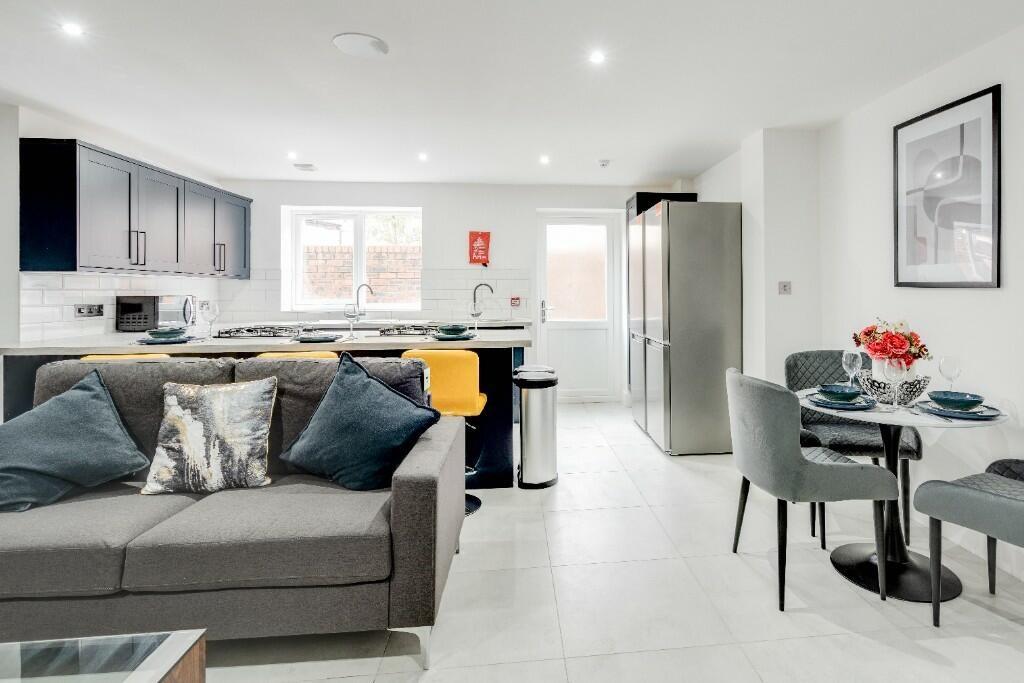 Bright and modern living room with large window...
