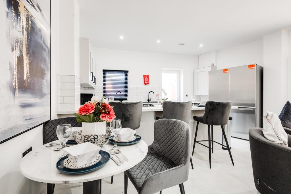 A spacious and modern living room with large wi...