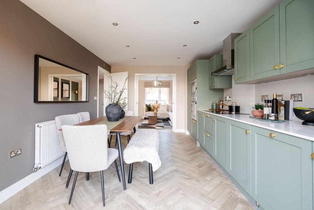 A modern kitchen and dining area with ample...