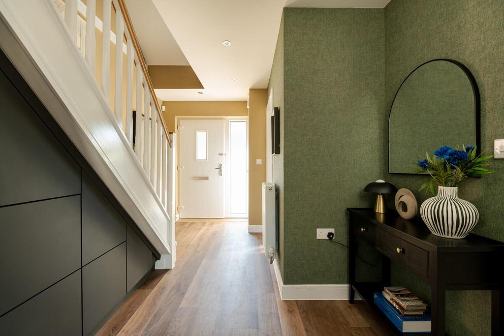 A welcoming hallway with cloakroom and storage...