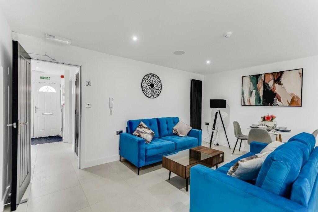 Bright and spacious living room featuring moder...