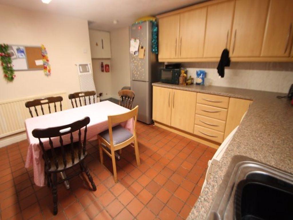 A bright and functional kitchen featuring woode...