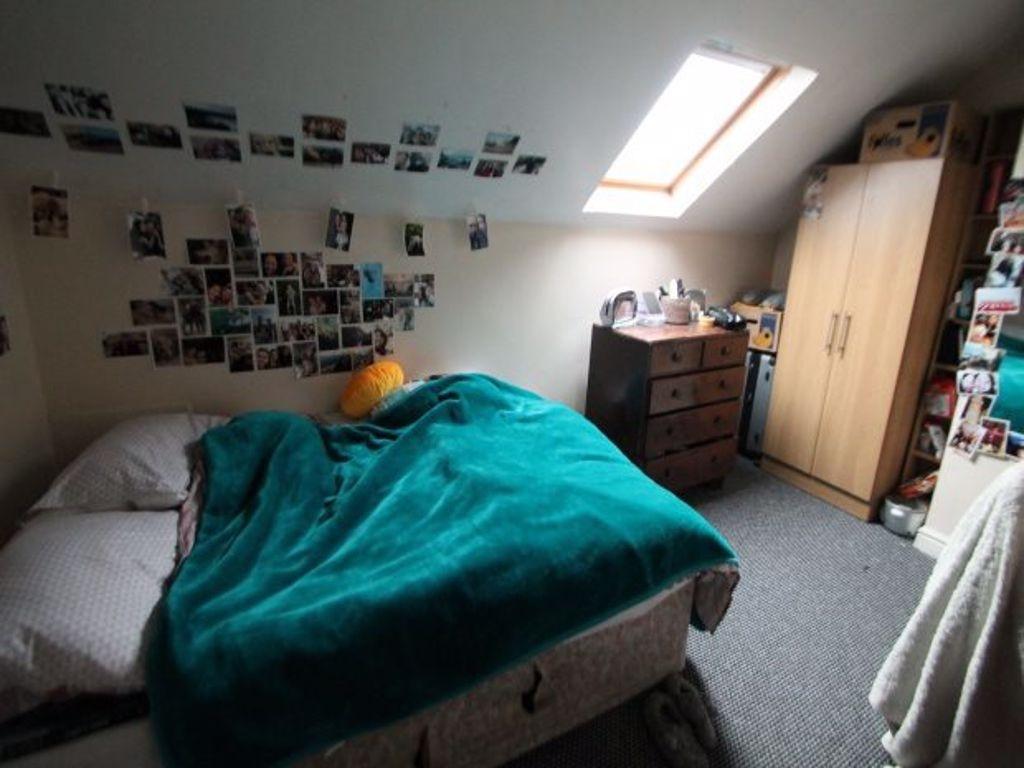A cozy bedroom with a comfortable double bed co...