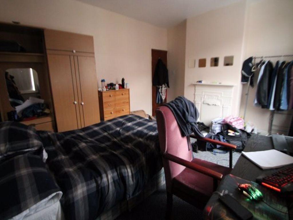 A spacious and comfortable living room featurin...