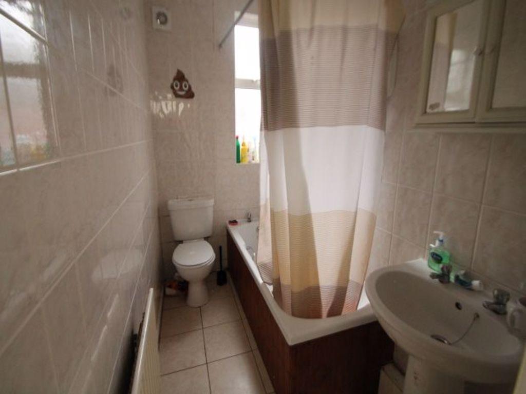 A neat and well-maintained bathroom featuring a...