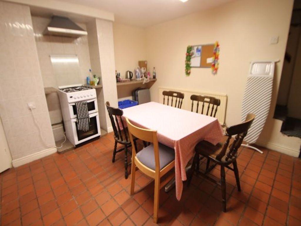 A cozy dining area featuring a table with a pin...