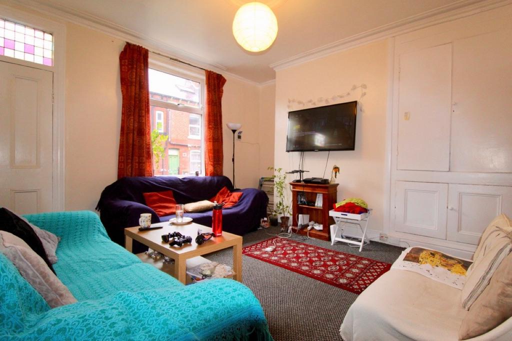 A bright and inviting living room featuring com...