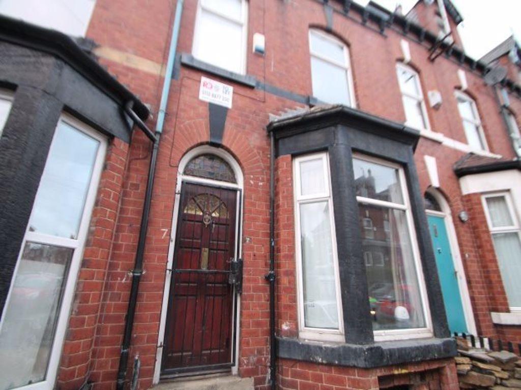 A charming exterior shot of a traditional brick...