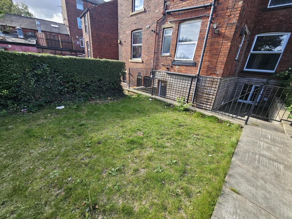 An inviting outdoor garden area featuring well-...