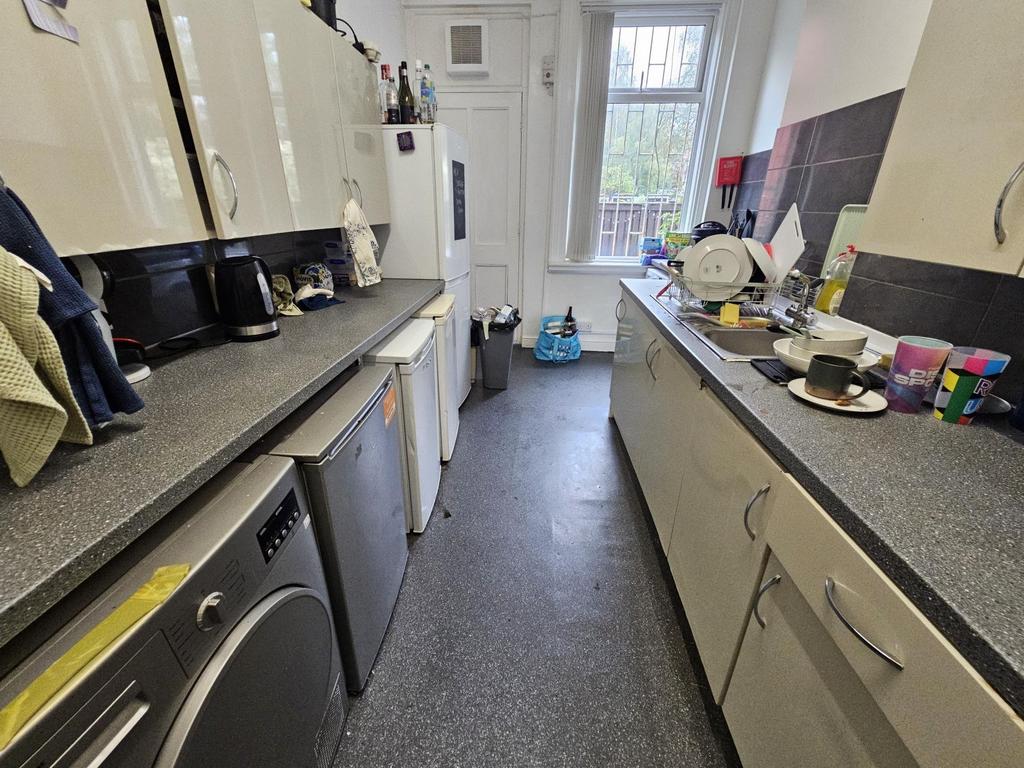 A functional kitchen area with ample countertop...