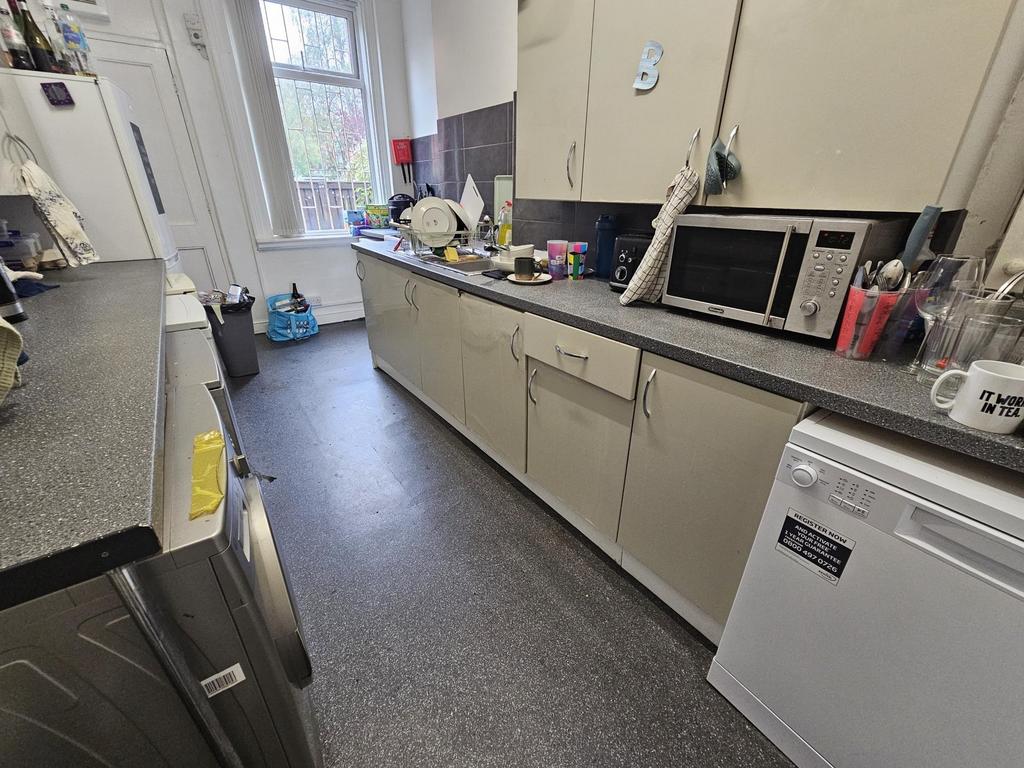 A bright and functional kitchen with ample coun...