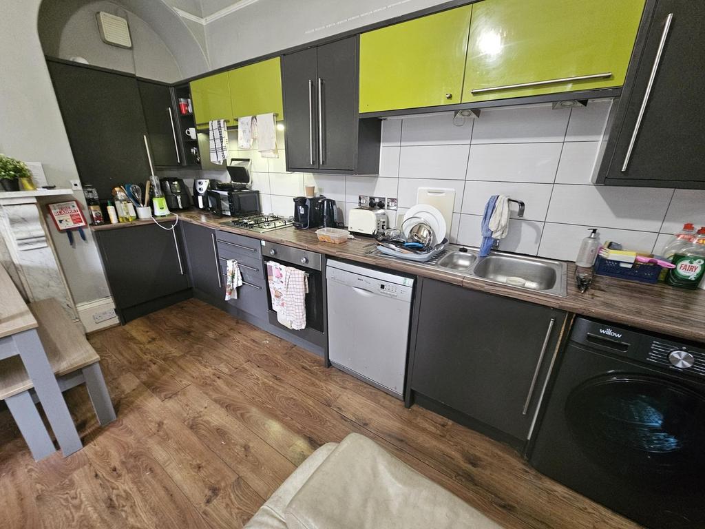A well-maintained kitchen with modern cabinetry...