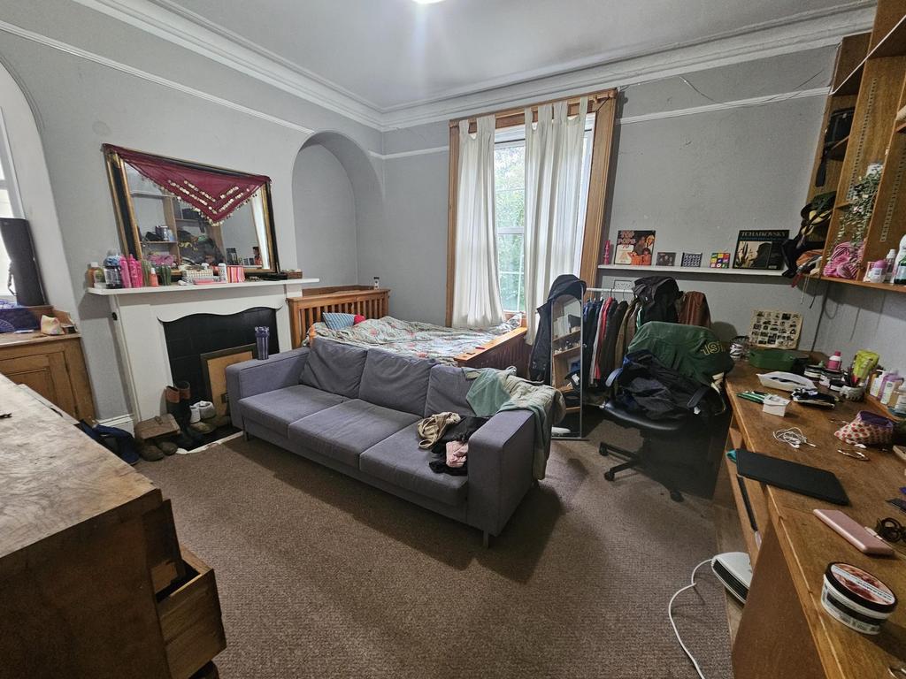 A welcoming living room featuring a comfortable...
