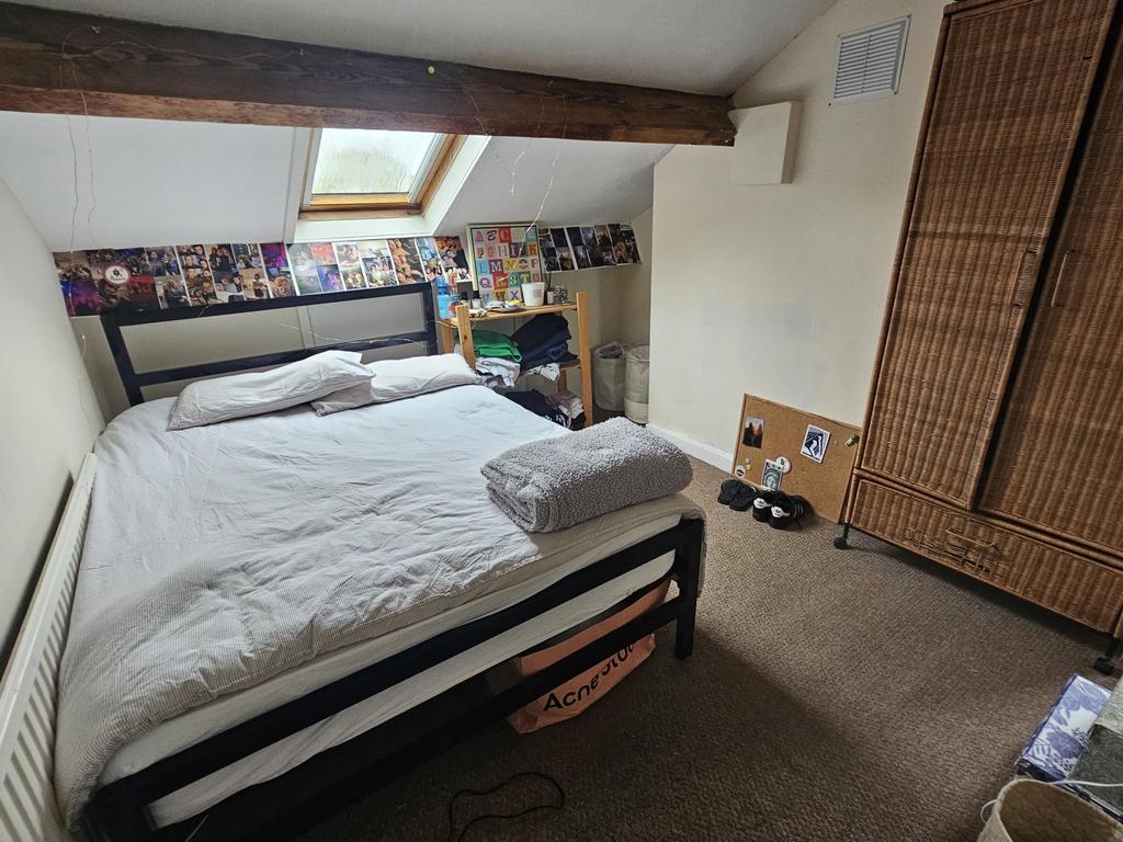 Spacious master bedroom with ample natural ligh...