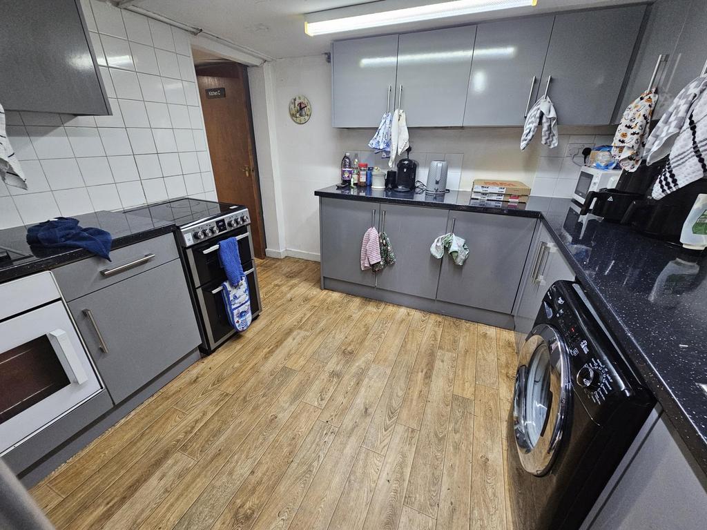 A bright, modern kitchen with ample workspace, ...