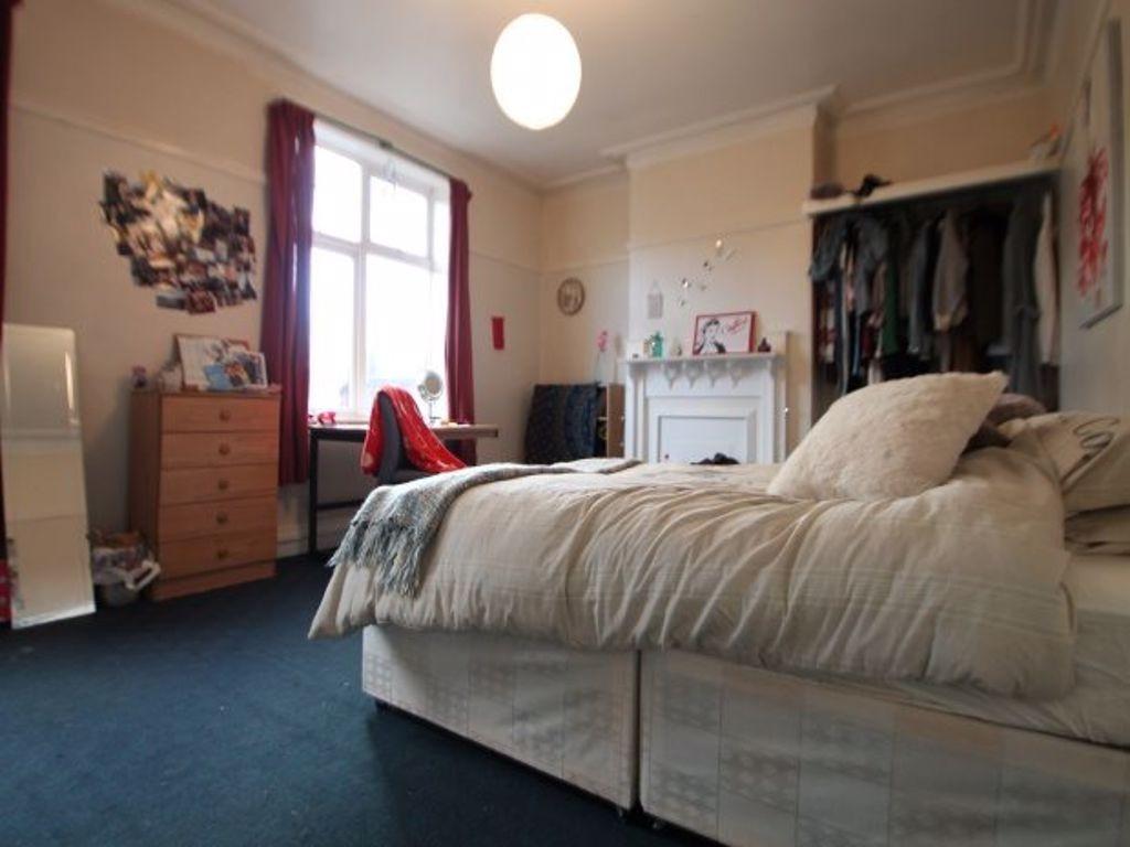 A spacious and inviting master bedroom featurin...