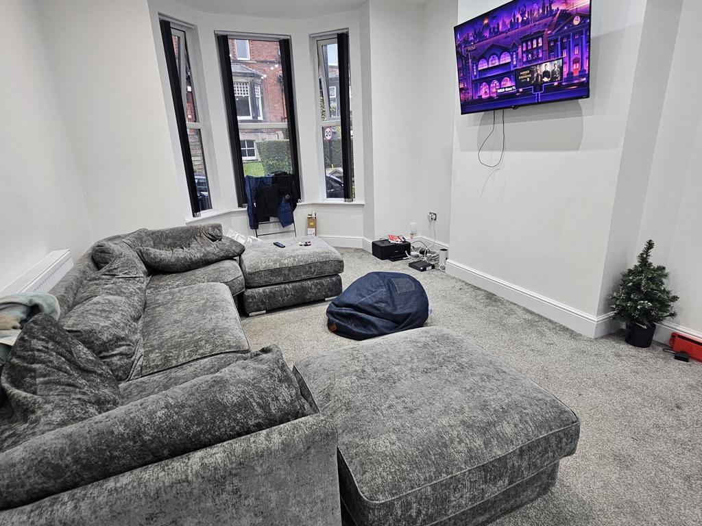 A modern and spacious living room featuring a l...