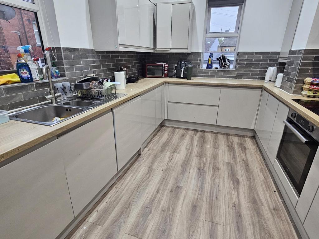 A modern, well-maintained kitchen with light-co...
