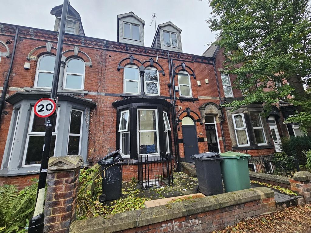 A charming brick-fronted house with classic arc...
