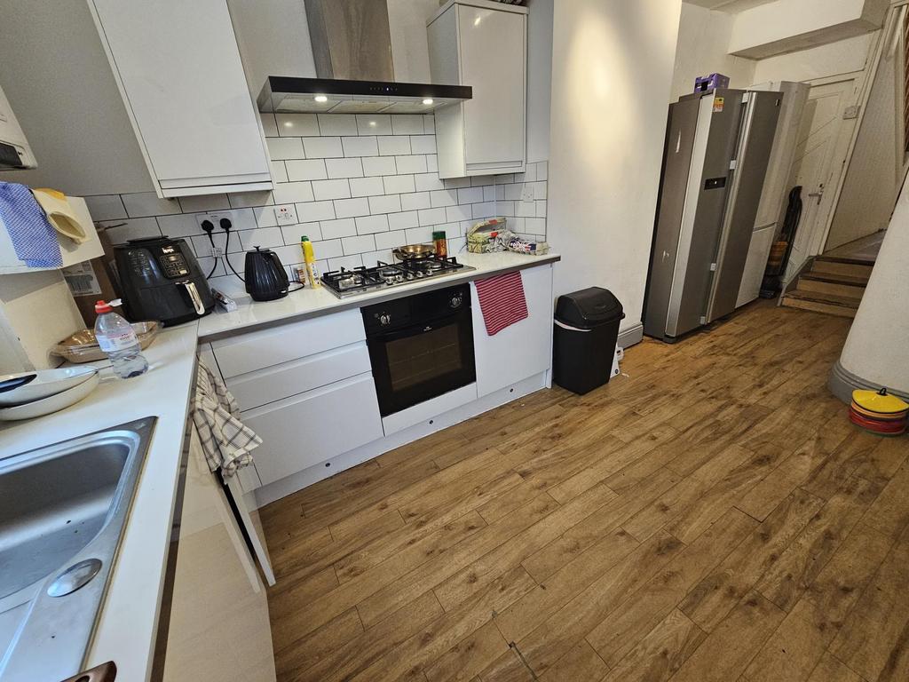 Bright and modern kitchen featuring ample count...