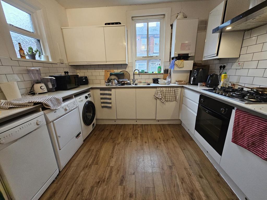 A bright and tidy kitchen with ample counter sp...