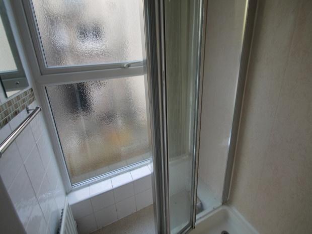 A clean and well-maintained bathroom featuring ...