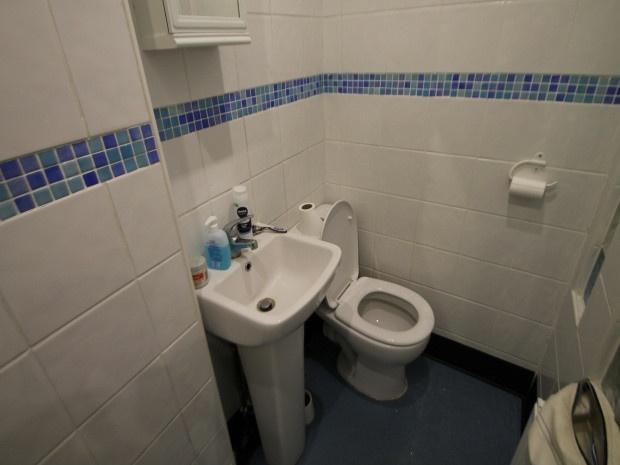 A clean, well-maintained bathroom featuring a t...