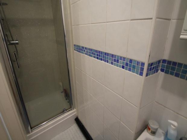 A clean and well-maintained bathroom featuring ...