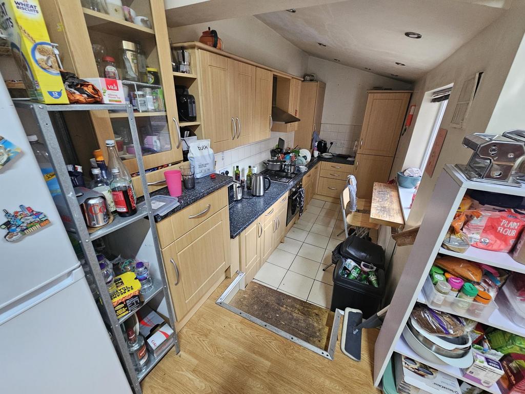 A well-equipped kitchen with ample storage, mod...