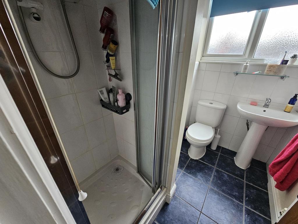 A clean and well-maintained bathroom with a sho...