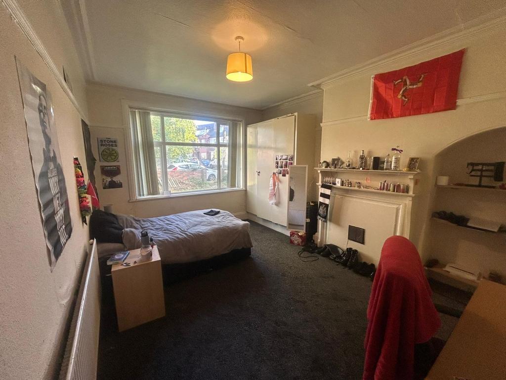 A cozy living room with a large window allowing...