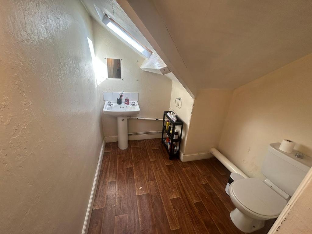 Bright and clean bathroom featuring a toilet an...