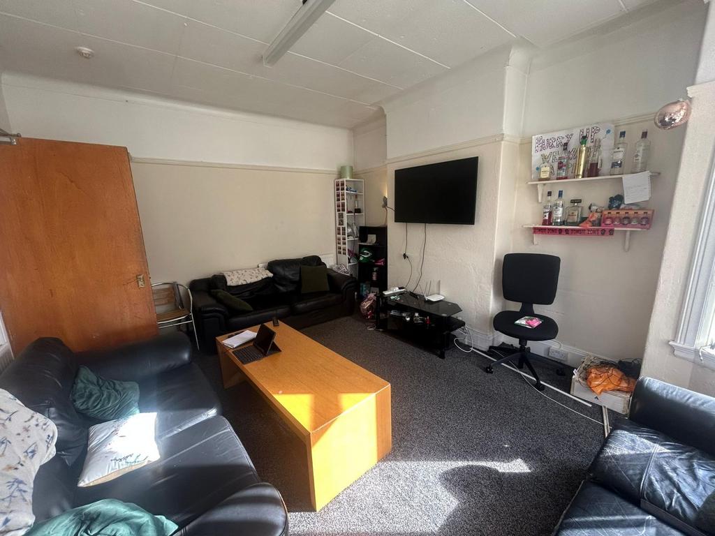 A spacious and inviting living room featuring m...