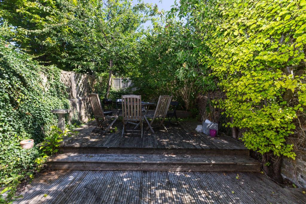 A beautifully maintained garden area surrounded...
